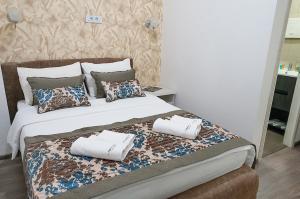 Tempat tidur dalam kamar di Apostolovic Plus