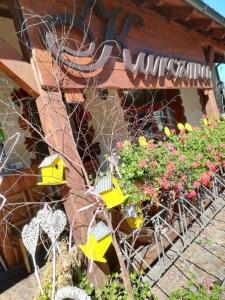 a building with flowers and plants in front of it at Dwa Dęby in Lubawka