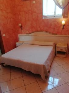 a bedroom with a bed in a room with a window at La Corte Dei Principi - Residenza D'Epoca in Florence