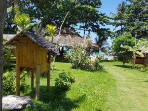 Ein Garten an der Unterkunft Margarita Beach