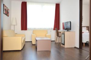 TV a/nebo společenská místnost v ubytování Hotel Opal Superior - Adults Only