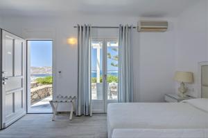 Cama ou camas em um quarto em Hotel Alkyon