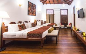Ένα ή περισσότερα κρεβάτια σε δωμάτιο στο The Heritage Hotel Galle Fort