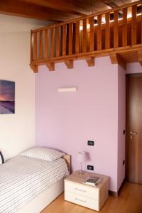 A bed or beds in a room at CASA GIULIA a Borso del Grappa