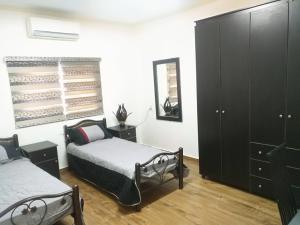 Säng eller sängar i ett rum på Aman Hostel