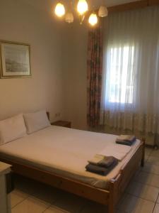 A bed or beds in a room at Villa Elena