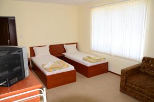 TV a/nebo společenská místnost v ubytování Kirovi House - guest rooms