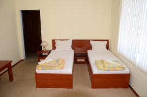 Postel nebo postele na pokoji v ubytování Kirovi House - guest rooms