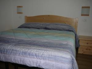 Postel nebo postele na pokoji v ubytování Casa Screm - Appartamenti e Camere -Rigolato - UD