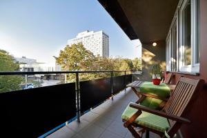 a balcony with a table and chairs on a balcony at Vla Vla Apartments, Zagreb City Center in Zagreb