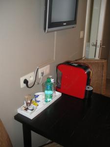 TV o dispositivi per l'intrattenimento presso Hotel Amaryllis