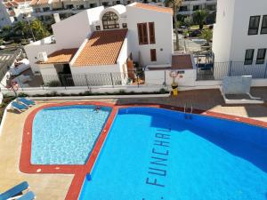 arial view of a swimming pool in front of a house at FN FUNCHAL Tenerife 101 in El Guincho