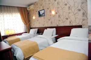 Postel nebo postele na pokoji v ubytování Saray Hotel
