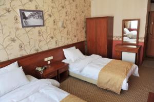 Postel nebo postele na pokoji v ubytování Saray Hotel