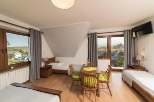 Ένα ή περισσότερα κρεβάτια σε δωμάτιο στο Szyszka