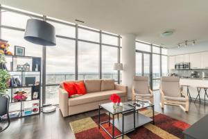 a living room with a couch and a table at Unbelievable Penthouse View with 3 bedrooms in Toronto