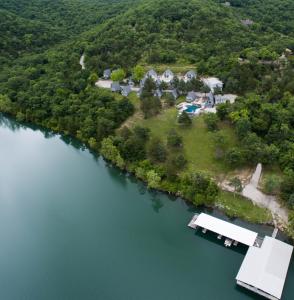 an aerial view of a house on an island in the water at Alpine Lodge Resort in Branson