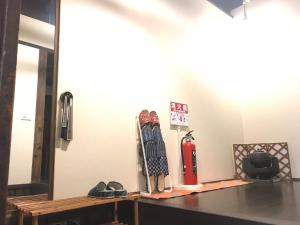 a group of skis on a table in a room at Private reservation near KIX "Wakeikan" in Hannan