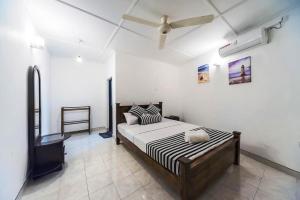 Postel nebo postele na pokoji v ubytování Cloud Inn Kandy Homestay - Kandy Perahera 2025