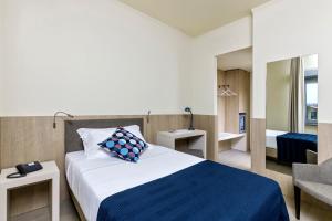Postel nebo postele na pokoji v ubytování Living Hotel Milano + 37 fotografií