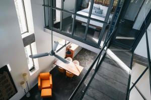 an overhead view of a room with a table and chairs at Urban Residences - Siem Reap in Siem Reap +56 photos