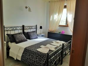 Postel nebo postele na pokoji v ubytování Villa Eos