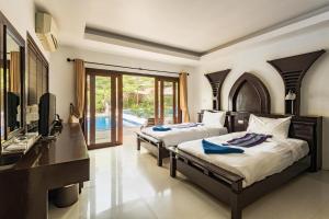 Postel nebo postele na pokoji v ubytování Koh Tao Regal Resort - SHA Plus