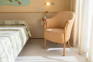 A bed or beds in a room at Savoy Hotel