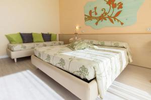 A bed or beds in a room at Savoy Hotel