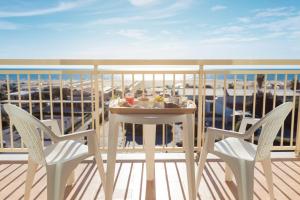 A balcony or terrace at Savoy Hotel