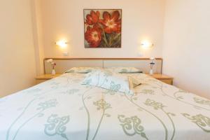 A bed or beds in a room at Savoy Hotel