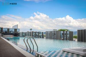 The swimming pool at or close to The Lucid Hangzhou XiXi Wetland Hotel