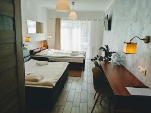 Postel nebo postele na pokoji v ubytování Hotel Miłosz Restauracja, Basen dla dzieci, Sala Zabaw, Siłownia