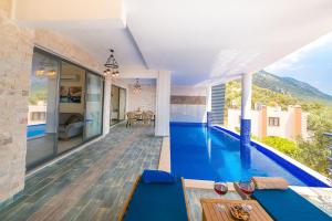 a swimming pool in the middle of a house at Villa Spring- Hill Villas Kalkan in Kaş