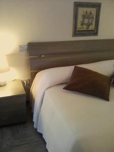 A bed or beds in a room at La Graziosa Dépendance