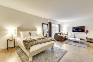 a bedroom with a large bed and a living room at Luxury Loft in Saint-Germain Des Près in Paris