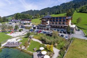 an aerial view of a hotel with a parking lot at Hotel Penzinghof in Oberndorf in Tirol