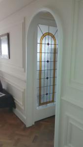 a room with a door with a stained glass window at Corrientes y Esmeralda in Buenos Aires