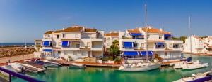 a group of boats are docked in a marina at Apartamentos El Puerto in Alcossebre