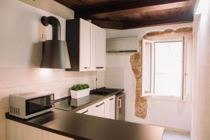 A kitchen or kitchenette at Apartment in the Heart of the City