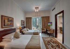 Кровать или кровати в номере Marina Hotel Apartments