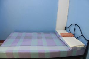 Letto o letti in una camera di Mayon Lodging House