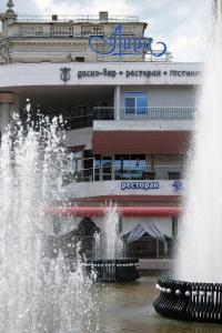 a water fountain in front of a cruise ship at Lira Hotel in Saratov