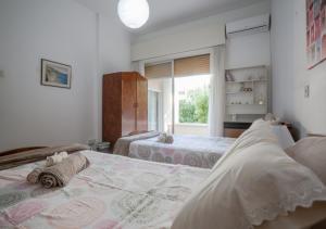 Ένα ή περισσότερα κρεβάτια σε δωμάτιο στο Sunny Family Home By The Beach +38 φωτογραφίες