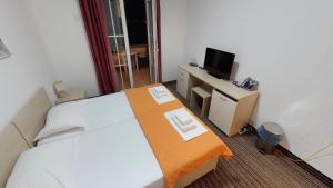 Postel nebo postele na pokoji v ubytování Hotel Belveder