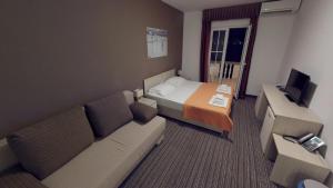 TV a/nebo společenská místnost v ubytování Hotel Belveder