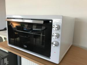 a microwave oven sitting on top of a counter at le 'Zone' in Sarreguemines