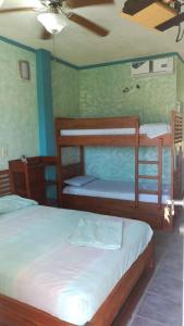 Postel nebo postele na pokoji v ubytování Hosteria Mar de Plata + 37 fotografií