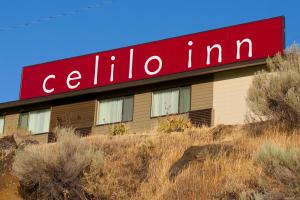 a building with a red sign on top of it at Celilo Inn in The Dalles