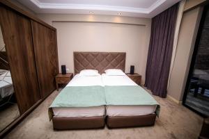 Postel nebo postele na pokoji v ubytování Boutique Hotel Mimino